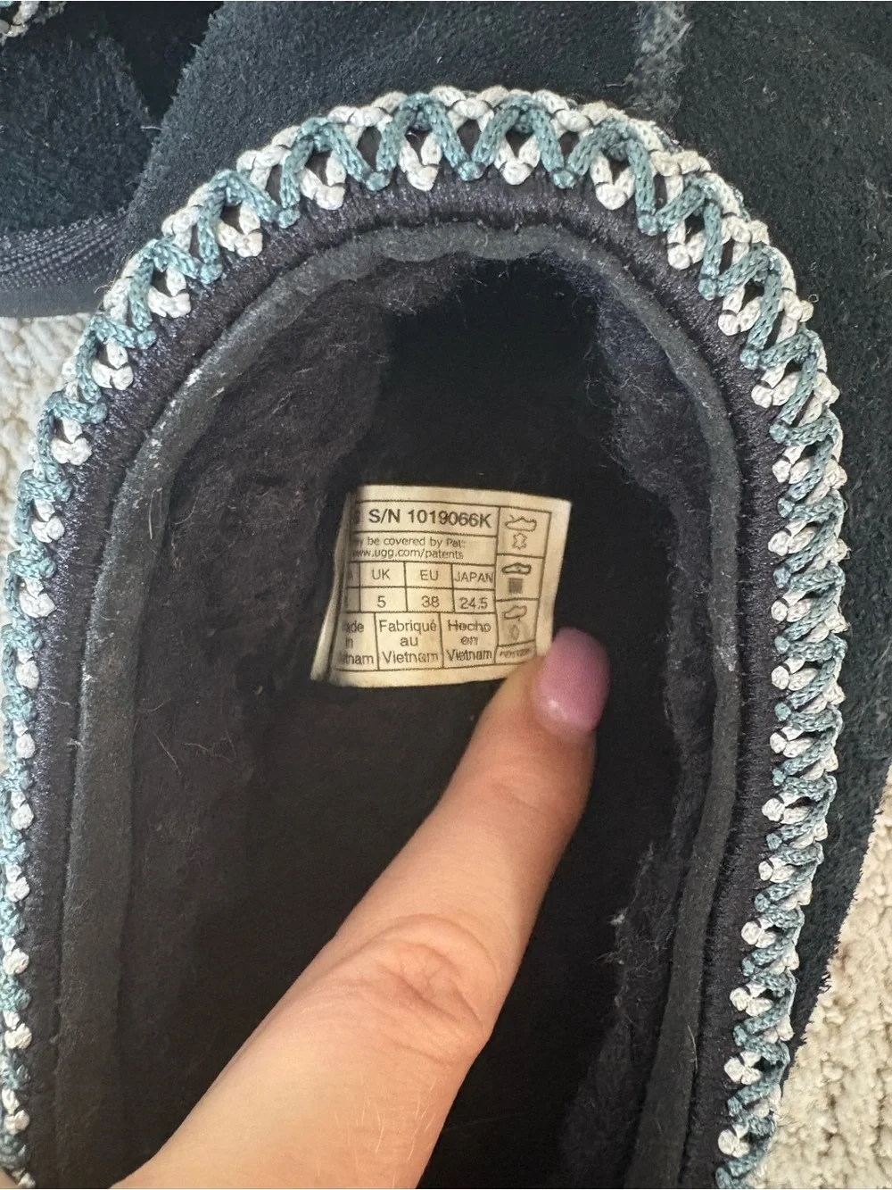 UGG Kids Black Slip-On Moccasin Slippers with Silver Trim